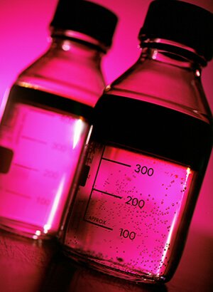 PInk chemistry bottles